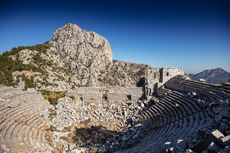 The roman theater in the ruins of the city of termessos in the mountains near antalya near the mediterranean coast of anatolia- termessos, antalya, turkeyの写真素材