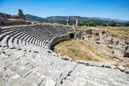 Xanthos Ancient City. Grave monument and the ruins of ancient city of Xanthos - Letoon in Kas, Antalya, Turkey at sunset. Capital of Lycia.の写真素材