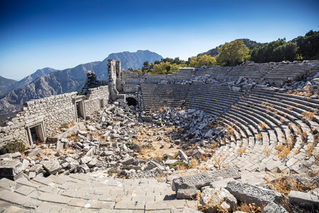 The roman theater in the ruins of the city of termessos in the mountains near antalya near the mediterranean coast of anatolia- termessos, antalya, turkeyの写真素材