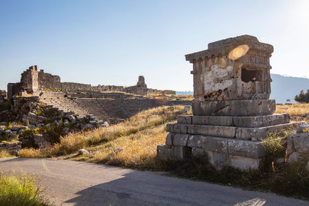Xanthos Ancient City. Grave monument and the ruins of ancient city of Xanthos - Letoon in Kas, Antalya, Turkey at sunset. Capital of Lycia.の写真素材