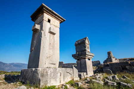 Xanthos Ancient City. Grave monument and the ruins of ancient city of Xanthos - Letoon in Kas, Antalya, Turkey at sunset. Capital of Lycia.の写真素材