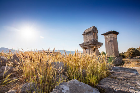 Xanthos Ancient City. Grave monument and the ruins of ancient city of Xanthos - Letoon in Kas, Antalya, Turkey at sunset. Capital of Lycia.の写真素材