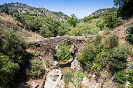 Old stone bridge over river in the Taurus Mountains in Turkey.の写真素材