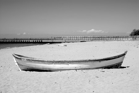 old fishing boat on the beach in black and white. high quality photoの写真素材