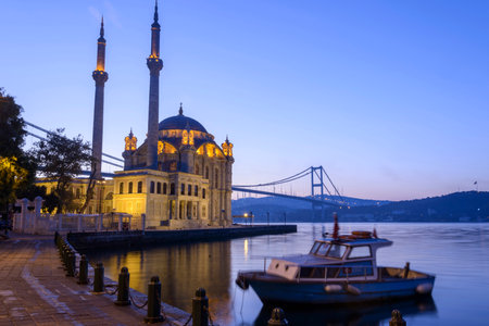 Colorful Ortakoy mosque and Bosphorus Bridge reflection on the seaの写真素材