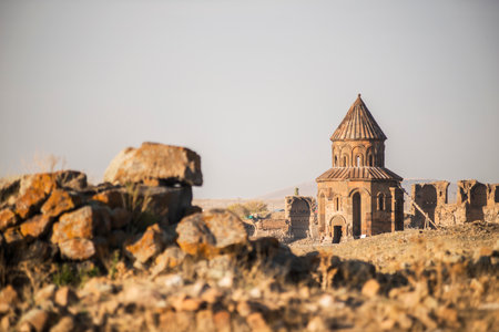 Ani ruins, Ani ancient city, historic abandoned structure with mountain background, Ani Ruins in Turkishの写真素材