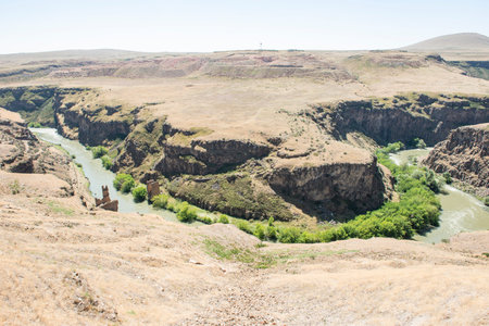Ani ruins, Ani ancient city, historic abandoned structure with mountain background, Ani Ruins in Turkishの写真素材