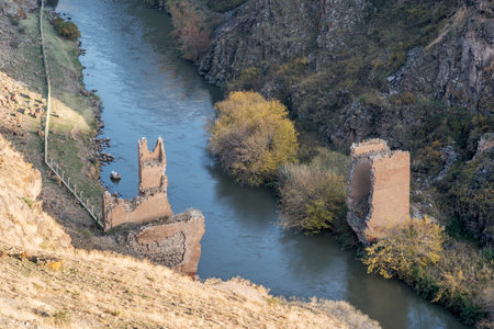 Ani ruins, Ani ancient city, historic abandoned structure with mountain background, Ani Ruins in Turkishの写真素材
