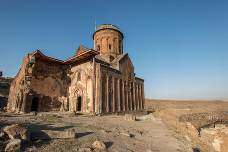 Ani ruins, Ani ancient city, historic abandoned structure with mountain background, Ani Ruins in Turkishの写真素材