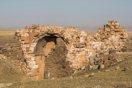 Ani ruins, Ani ancient city, historic abandoned structure with mountain background, Ani Ruins in Turkishの写真素材