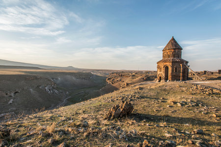 Ani ruins, Ani ancient city, historic abandoned structure with mountain background, Ani Ruins in Turkishの写真素材