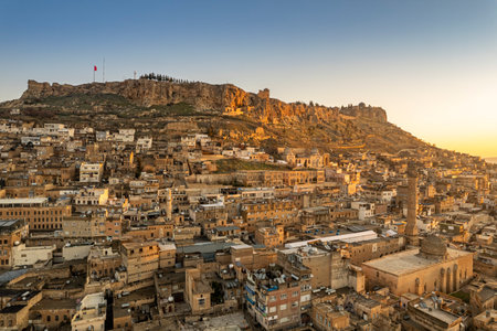 Traditional stone houses of Mardin Old town Mesopotamia in the background- Mardin, Turkeyの写真素材