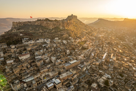Traditional pink stone houses of Mardin Old town Mesopotamia in the background- Mardin, Turkeyの写真素材
