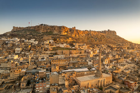 Traditional pink stone houses of Mardin Old town Mesopotamia in the background- Mardin, Turkeyの写真素材