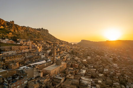 Traditional pink stone houses of Mardin Old town Mesopotamia in the background- Mardin, Turkeyの写真素材