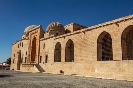 Traditional pink stone houses of Mardin Old town Mesopotamia in the background- Mardin, Turkeyの写真素材