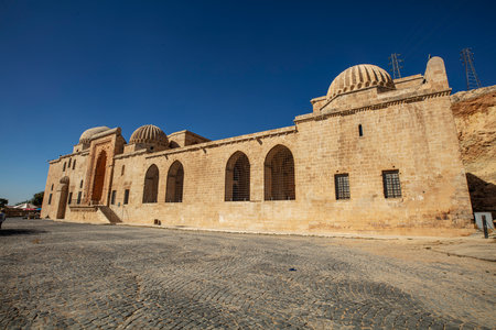 Traditional pink stone houses of Mardin Old town Mesopotamia in the background- Mardin, Turkeyの写真素材