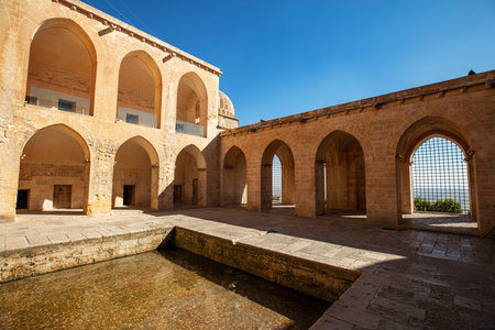 Traditional pink stone houses of Mardin Old town Mesopotamia in the background- Mardin, Turkeyの写真素材