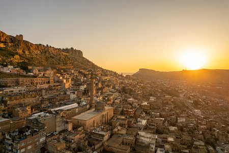 Traditional pink stone houses of Mardin Old town Mesopotamia in the background- Mardin, Turkeyの写真素材