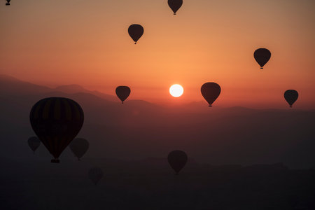 Beautiful landscape with colorful hot air balloons at sunrise, Cappadocia, Turkeyの写真素材