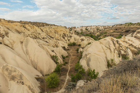 View of Uchisar Castle valley, Ancient town Anatolia amazing landscape, Travel of Turkey Goreme Cappadocia Turkiye, popular tourist destination world heritage unesco.の写真素材