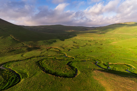 Aerial drone panorama landscape photo of Persembe Plateau (aka PerÅembe Yaylasi), creek meander (aka meander) and sheep on grassland, Aybasti, Ordu, Blacks Sea Region of Turkeyの写真素材