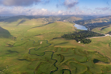 Aerial drone panorama landscape photo of Persembe Plateau (aka PerÅembe Yaylasi), creek meander (aka meander) and sheep on grassland, Aybasti, Ordu, Blacks Sea Region of Turkeyの写真素材