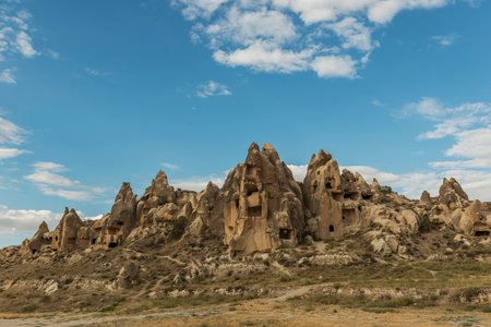 View of Uchisar Castle valley, Ancient town Anatolia amazing landscape, Travel of Turkey Goreme Cappadocia Turkiye, popular tourist destination world heritage unesco.の写真素材