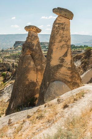 View of Uchisar Castle valley, Ancient town Anatolia amazing landscape, Travel of Turkey Goreme Cappadocia Turkiye, popular tourist destination world heritage unesco.の写真素材