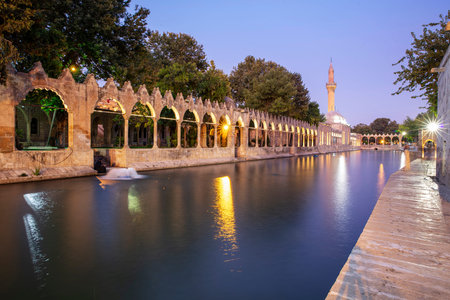 Balikligol (The Fish Lake) in Sanliurfa, Turkey. Panorama of the Pool of Abraham or Pool of Sacred...