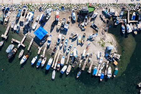 Aerial view of fishing boats in the harbor. top view