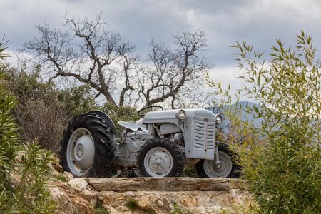 Old tractor on a rock in the desert of Crete, Greeceの写真素材