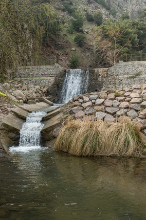 Small waterfall in the mountains of the Sierra Nevada in Spain in winter