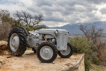 Old tractor on a dirt road in the Sierra Nevada mountains, Spainの写真素材