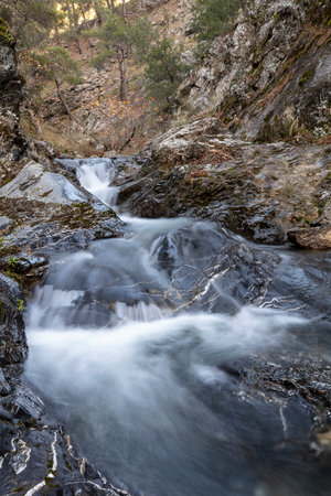 Beautiful waterfall in the mountains. Long exposure. Toned.の写真素材