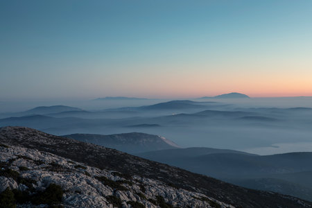 Mountain landscape with fog in the valley at sunrise. Crimea, Ukraineの写真素材