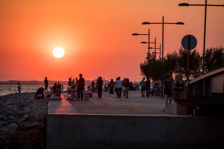 People doing sports in the morning on the Bostanli shore. Bostanli is a neighborhood of Karsiyaka province of Izmirの写真素材