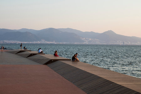 People doing sports in the morning on the Bostanli shore. Bostanli is a neighborhood of Karsiyaka province of Izmirの写真素材