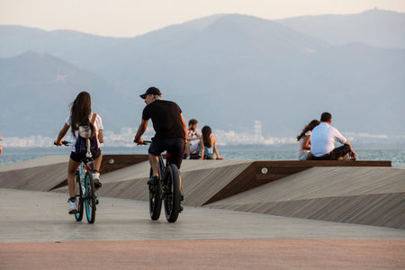 People doing sports in the morning on the Bostanli shore. Bostanli is a neighborhood of Karsiyaka...