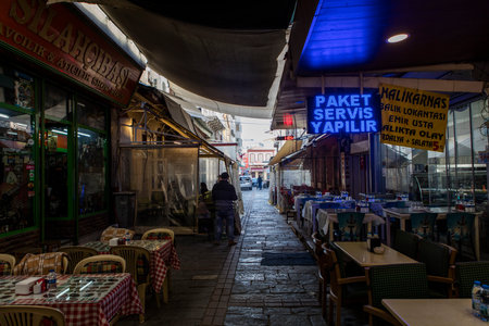 People on the street in Kemeralti district. Kemeralti (Kemeralti Carsisi) is a historical market (bazaar) district of Konak. Izmir, Turkeyの写真素材