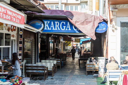 People on the street in Kemeralti district. Kemeralti (Kemeralti Carsisi) is a historical market (bazaar) district of Konak. Izmir, Turkeyの写真素材
