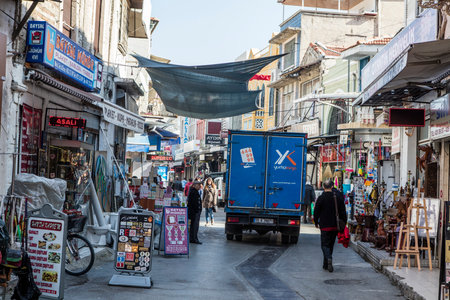 People on the street in Kemeralti district. Kemeralti (Kemeralti Carsisi) is a historical market (bazaar) district of Konak. Izmir, Turkeyの写真素材
