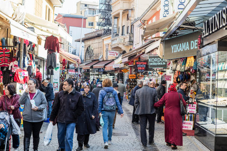 People on the street in Kemeralti district. Kemeralti (Kemeralti Carsisi) is a historical market...