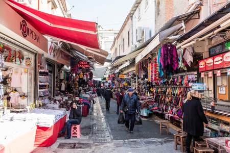 People on the street in Kemeralti district. Kemeralti (Kemeralti Carsisi) is a historical market...