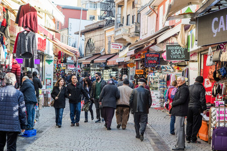 People on the street in Kemeralti district. Kemeralti (Kemeralti Carsisi) is a historical market...