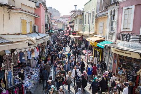People on the street in Kemeralti district. Kemeralti (Kemeralti Carsisi) is a historical market (bazaar) district of Konak. Izmir, Turkeyの写真素材