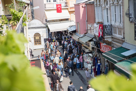 People on the street in Kemeralti district. Kemeralti (Kemeralti Carsisi) is a historical market...