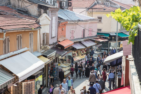People on the street in Kemeralti district. Kemeralti (Kemeralti Carsisi) is a historical market (bazaar) district of Konak. Izmir, Turkeyの写真素材