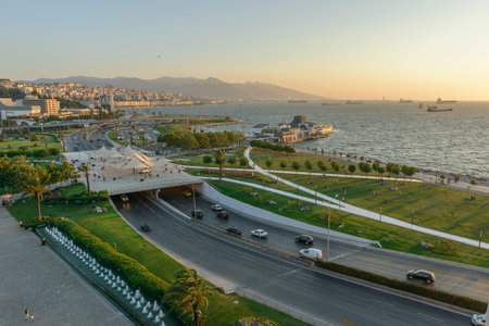 Konak Square street view with old clock tower (Clock Tower) at sunset. It was built in 1901 and accepted as the official symbol of Izmir City, Turkey.の写真素材