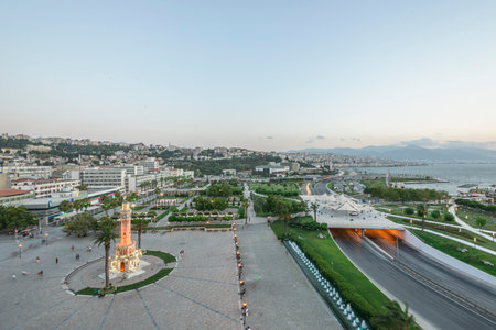 Konak Square street view with old clock tower (Clock Tower) at sunset. It was built in 1901 and accepted as the official symbol of Izmir City, Turkey.の写真素材